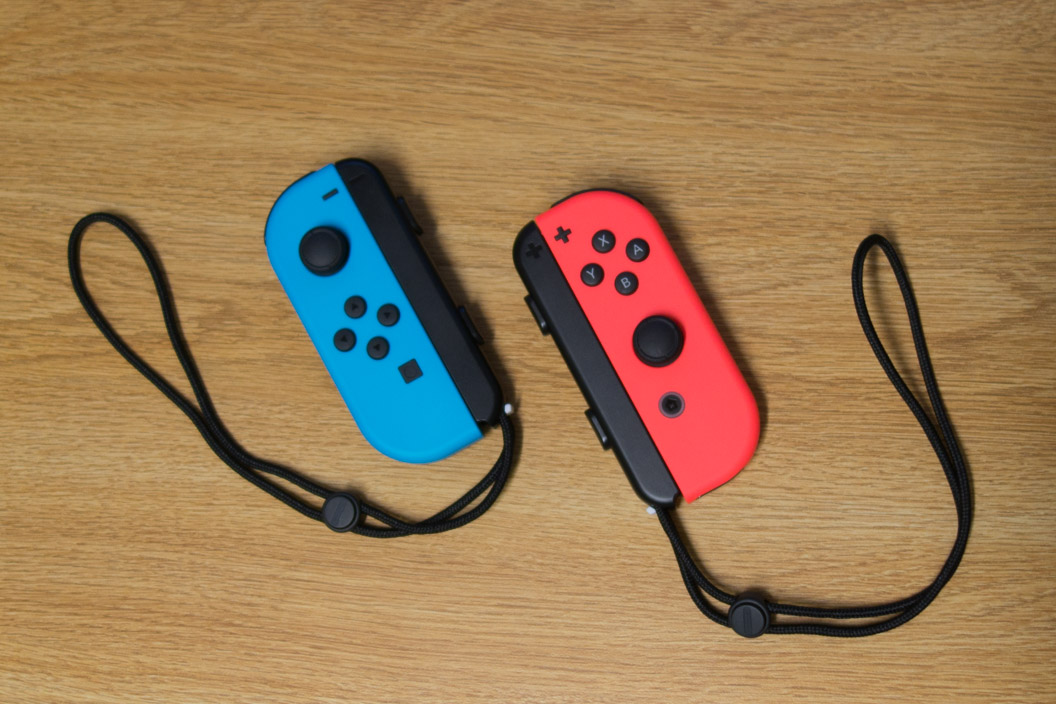Joy-Con controllers with straps